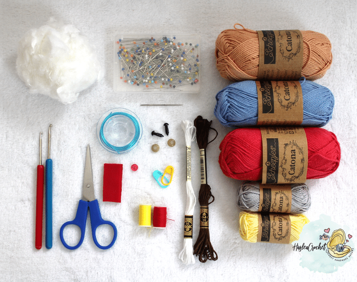 Complete crochet material layout with Scheepjes Catona yarn, stuffing, safety eyes, hooks, and accessories for making Super Biquette